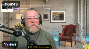 Gaz X presenting a live current affairs broadcast, wearing headphones and speaking into a microphone in his virtual studio.
